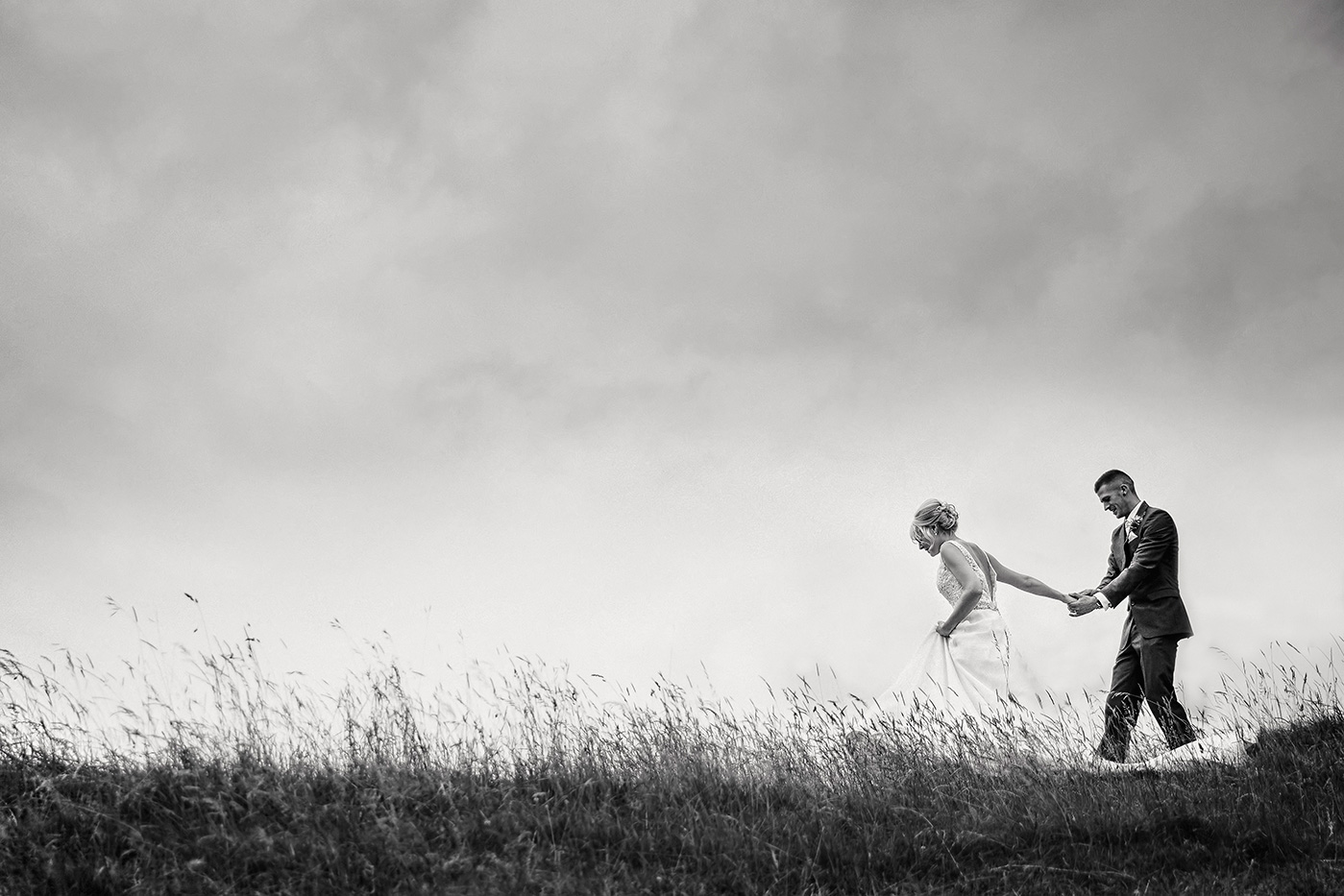 Couple on the hill at Kingsctoe barn