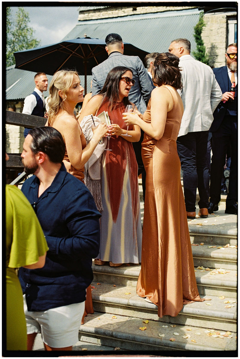 Documentary-style film wedding photography during a Cotswolds reception