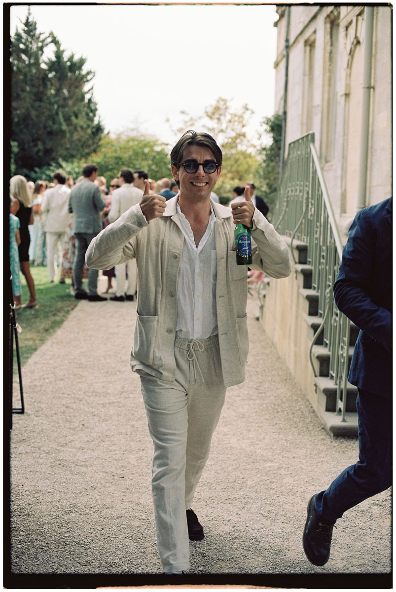 Guests enjoying a relaxed drinks reception photographed on film