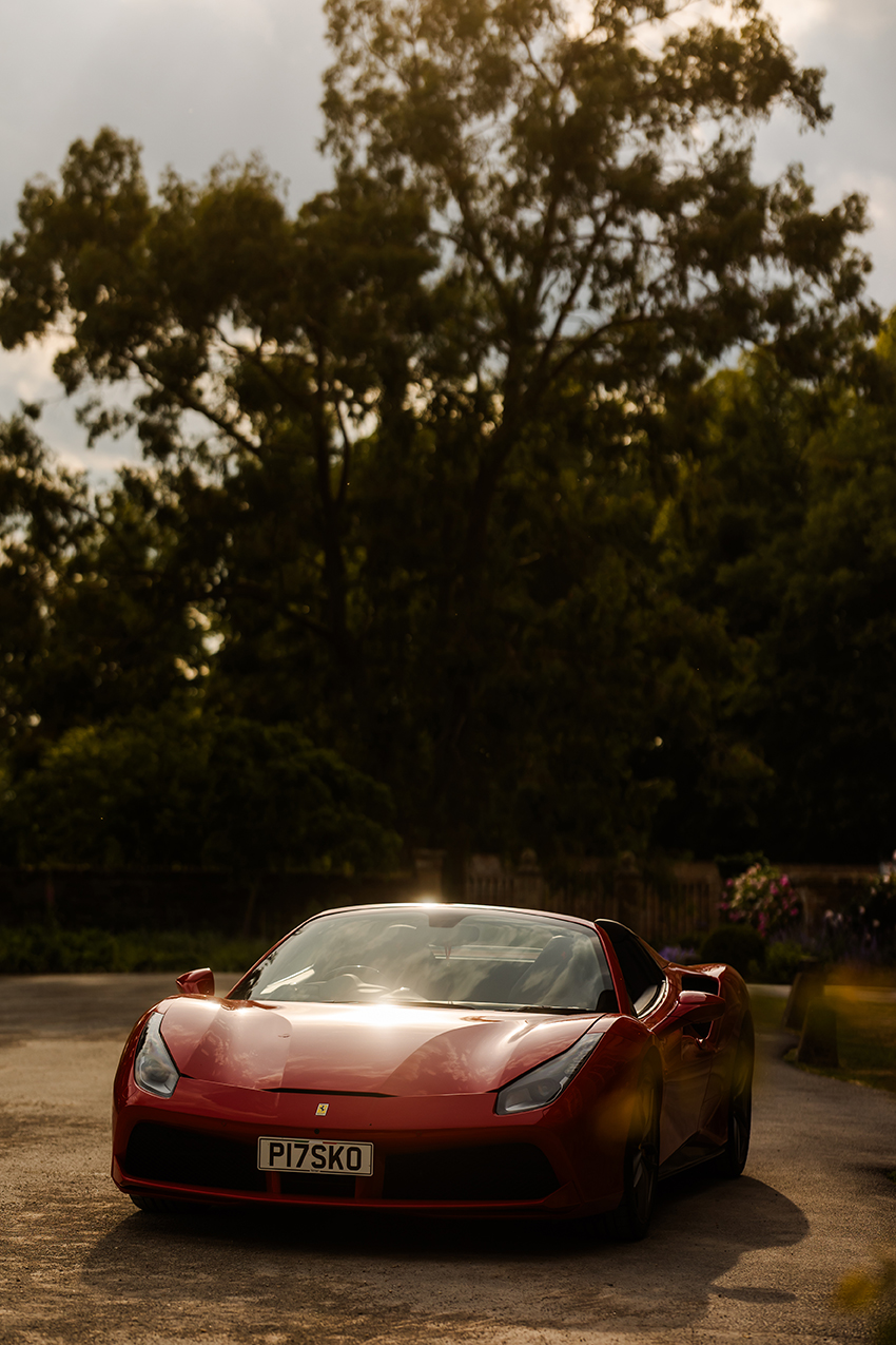 Red Porsche outside a london wedding venue  