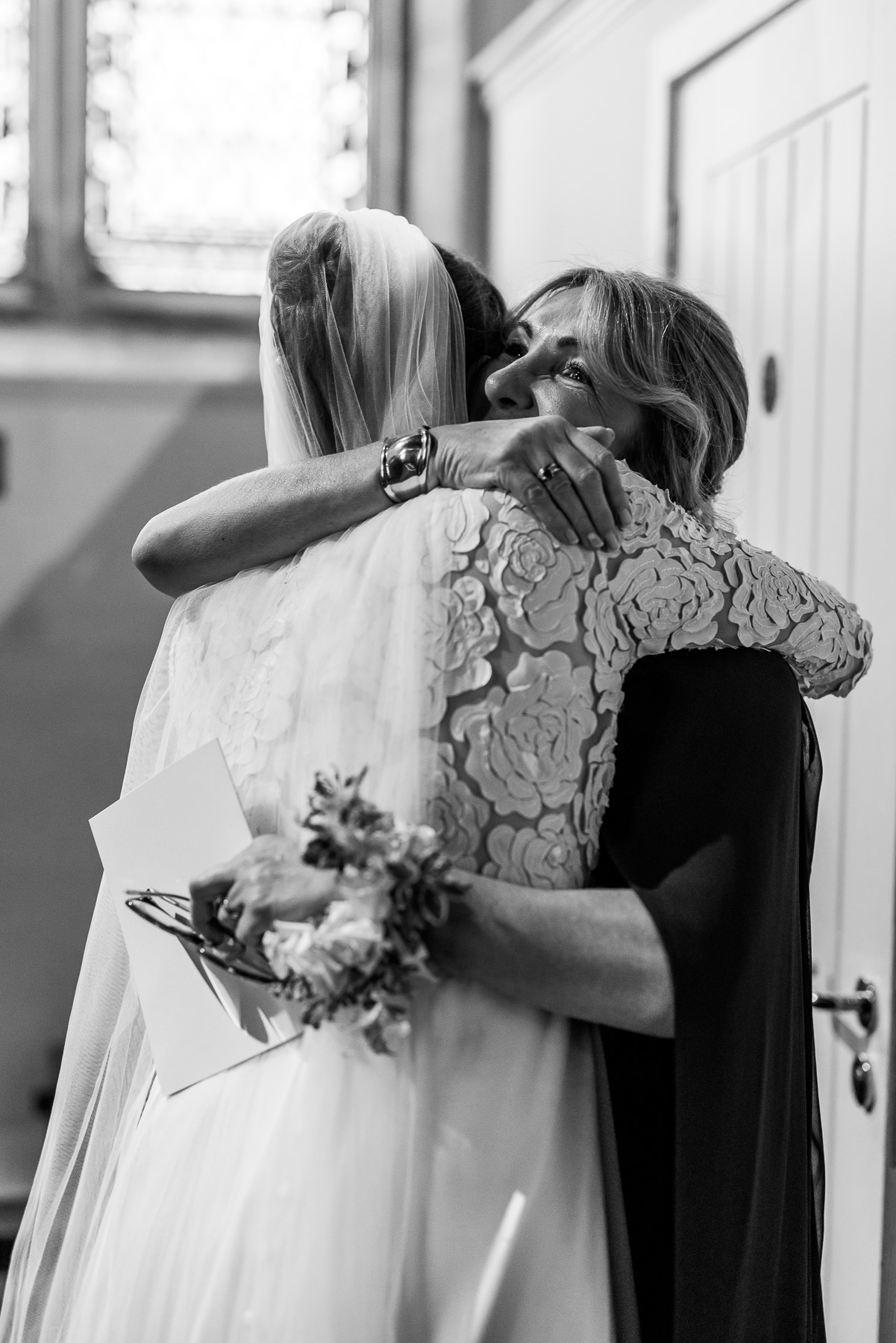 Bride hugging mother of the groom 