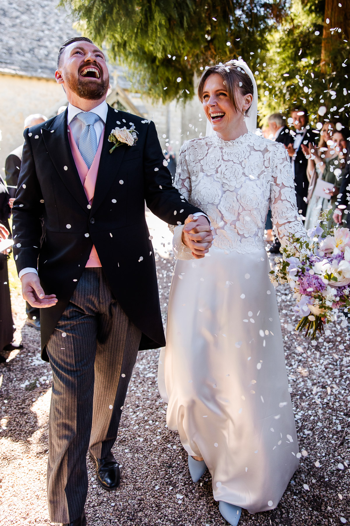 Mrs and Mrs walking through the confetti line at Elmore Church 