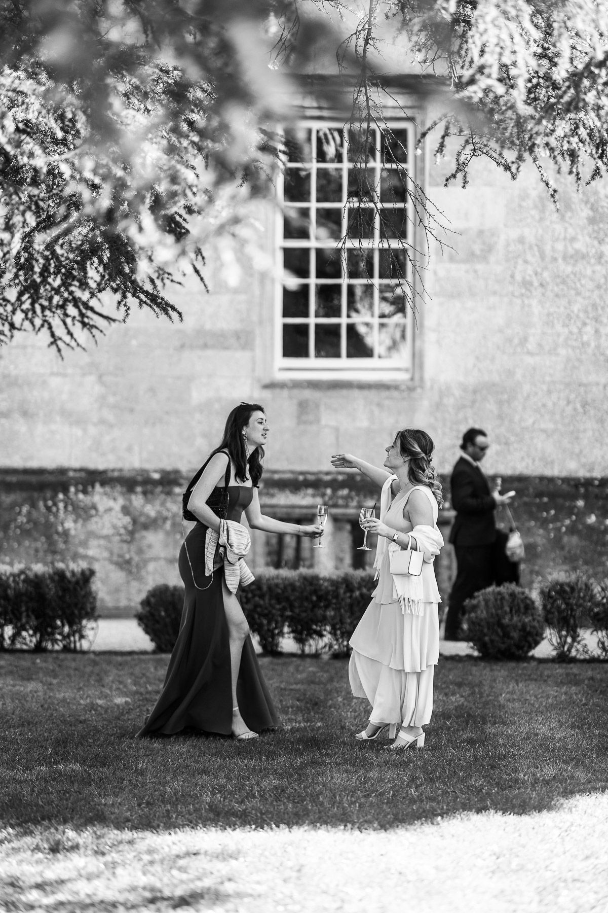 Friends about to hug on the Lawn at Elmore 