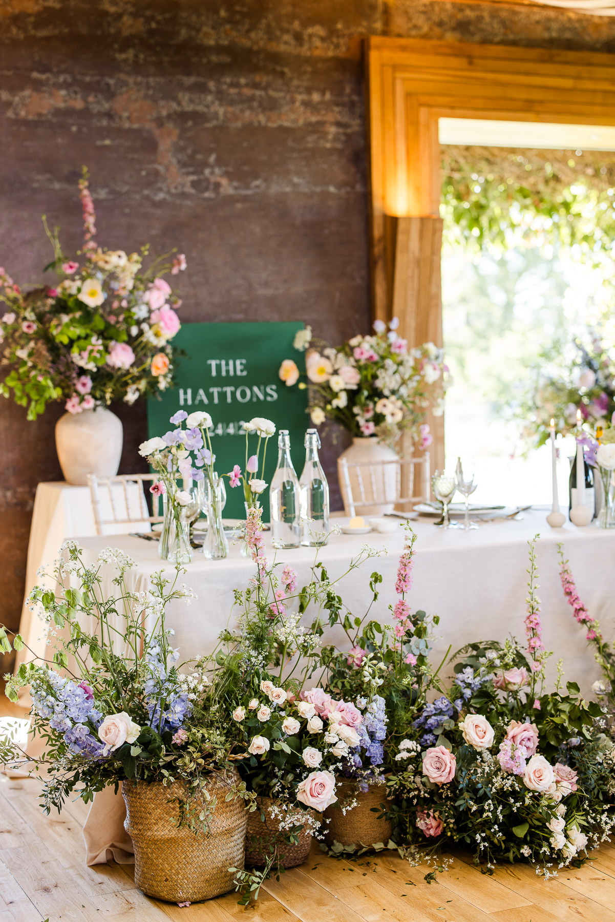 The top table adorned with spring flowers 