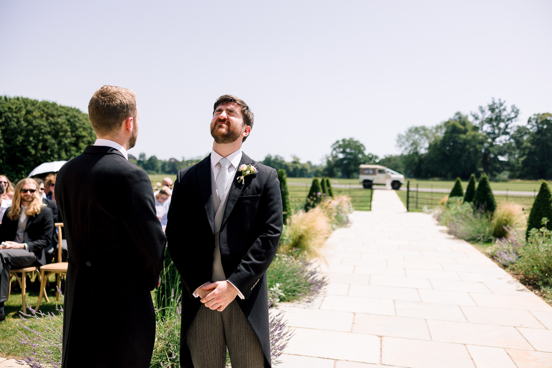Groom putting his head back in anticipation at Ivy Lodge 