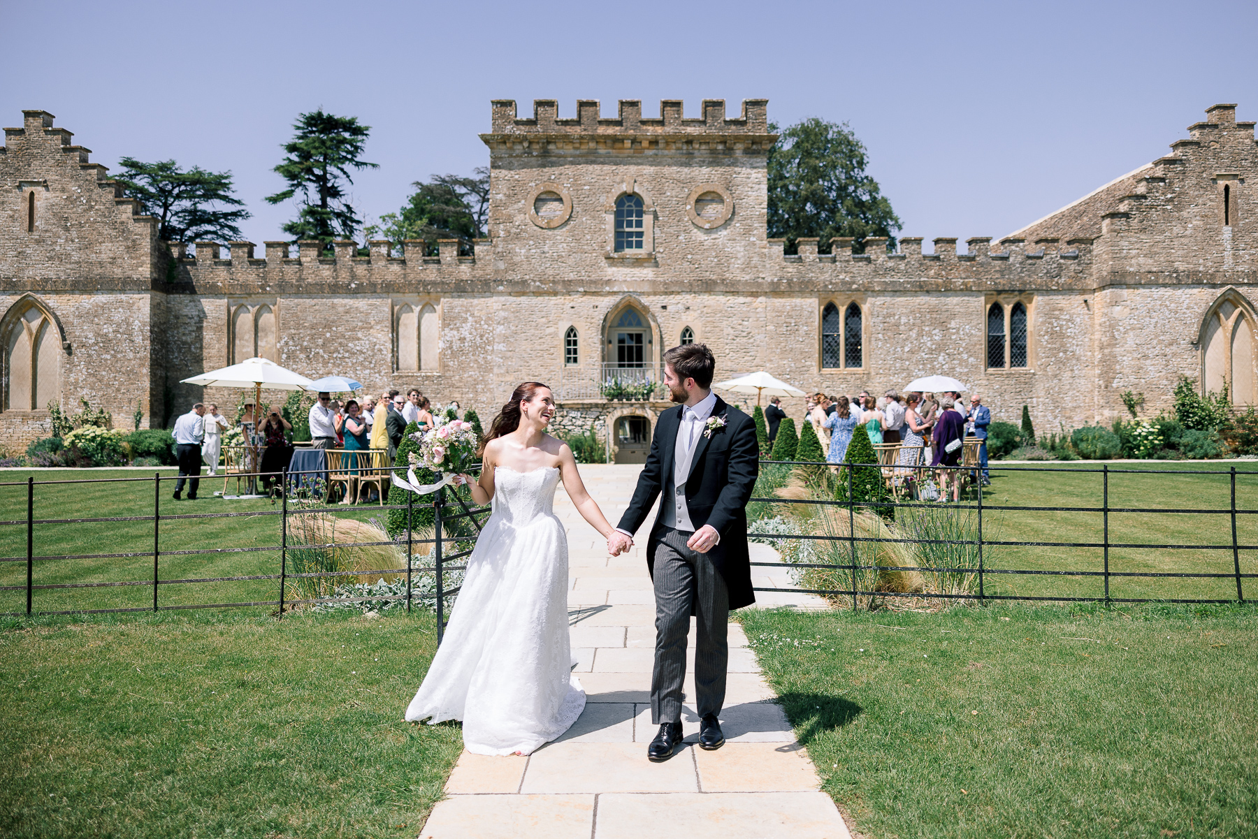 Couple walking back down the aisle in Cirencester 