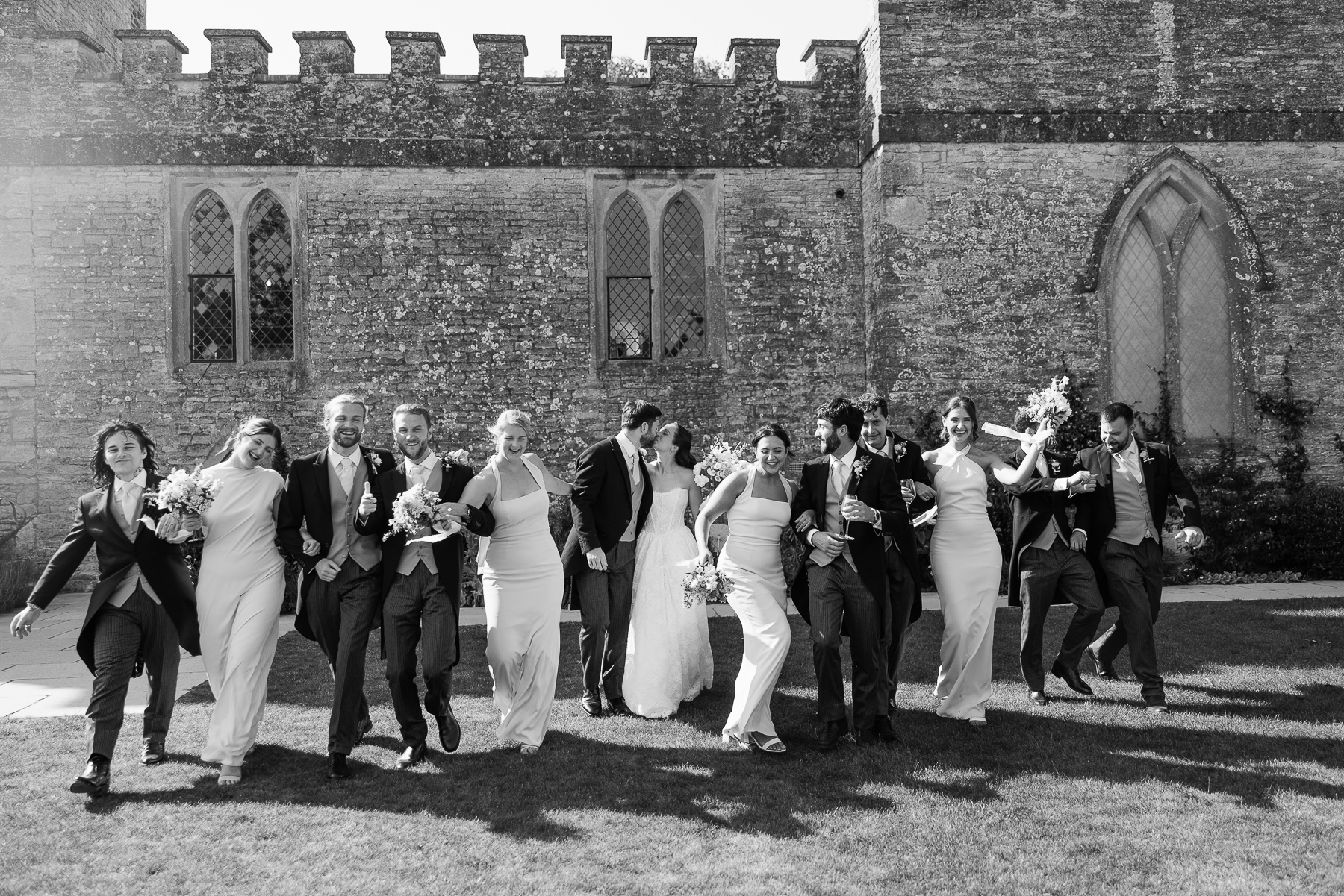 Group shot of wedding party having fun 