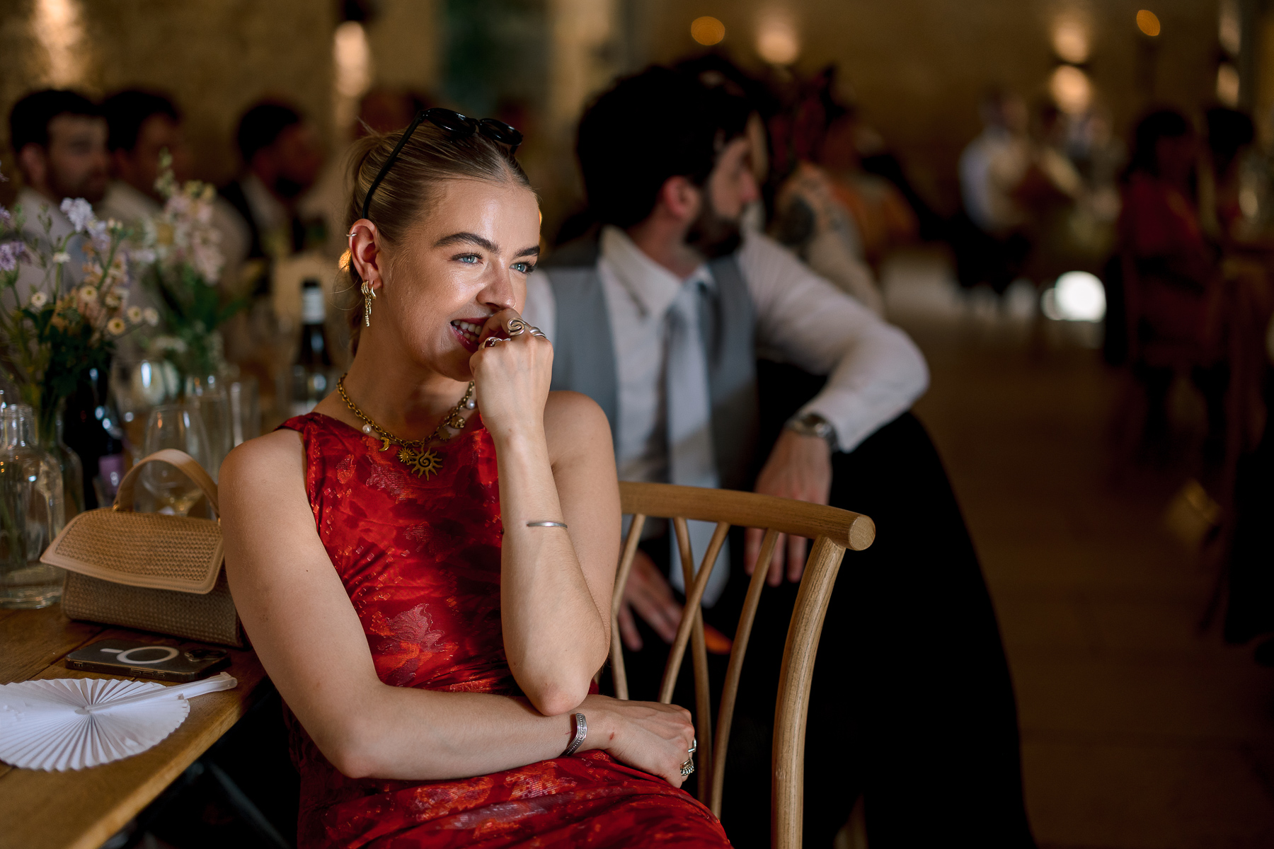 Lady in a red dress  crying at the speech 