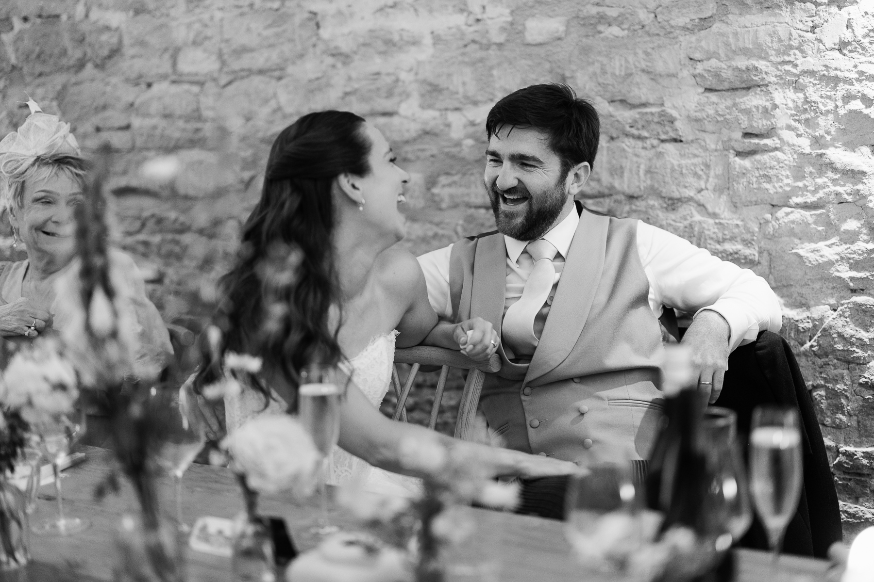 Couple laughing at the speeches 