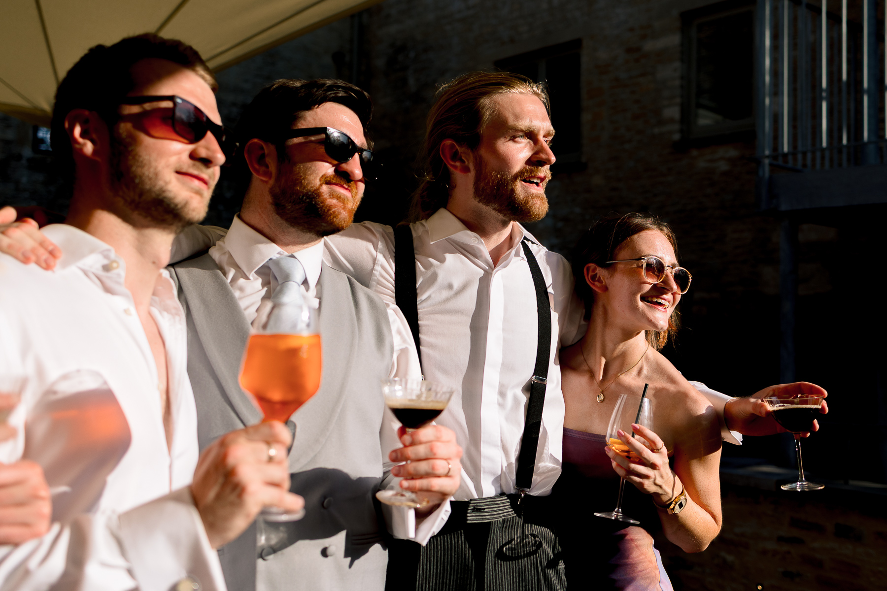 Group with drinks outside Ivy lodge 