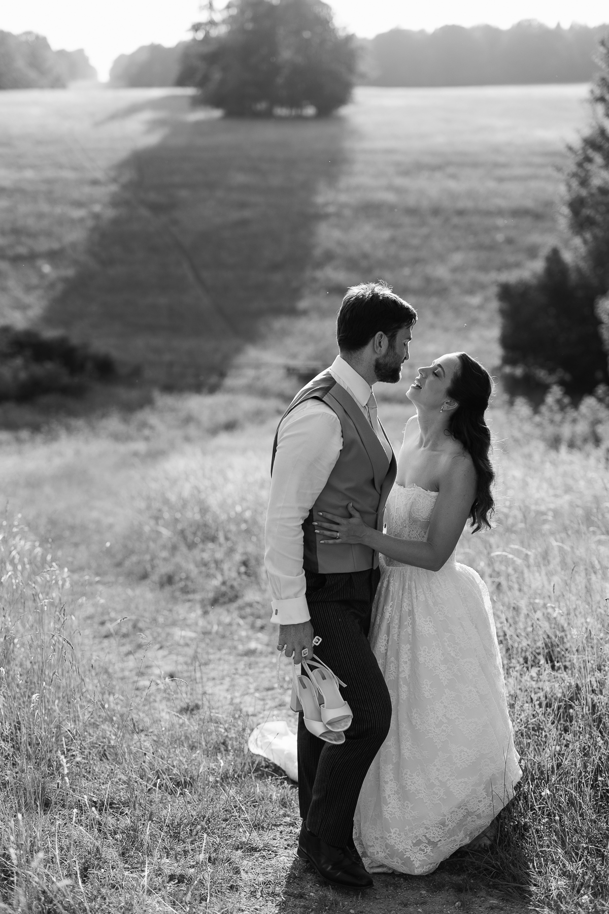 Couple standing in beautiful light at Ivy Lodge Cirencester<br />
