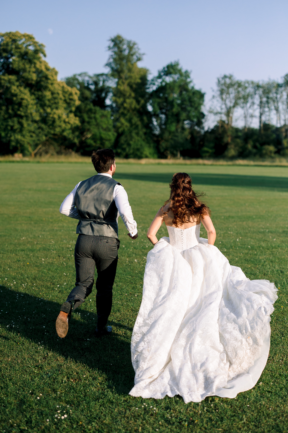 Couple running away from the camera 