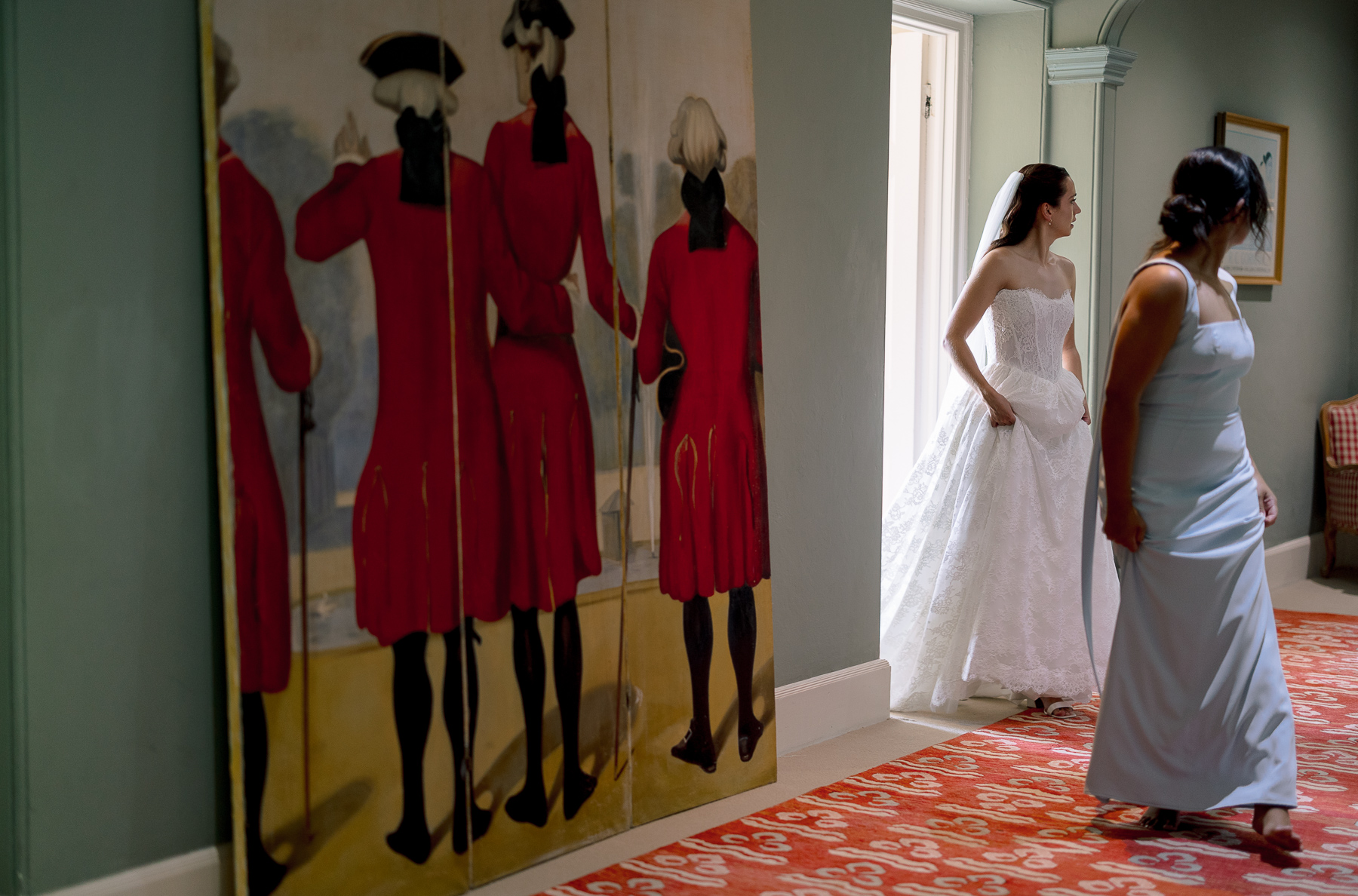 Bride and bridesmaids walking out of the prep room 