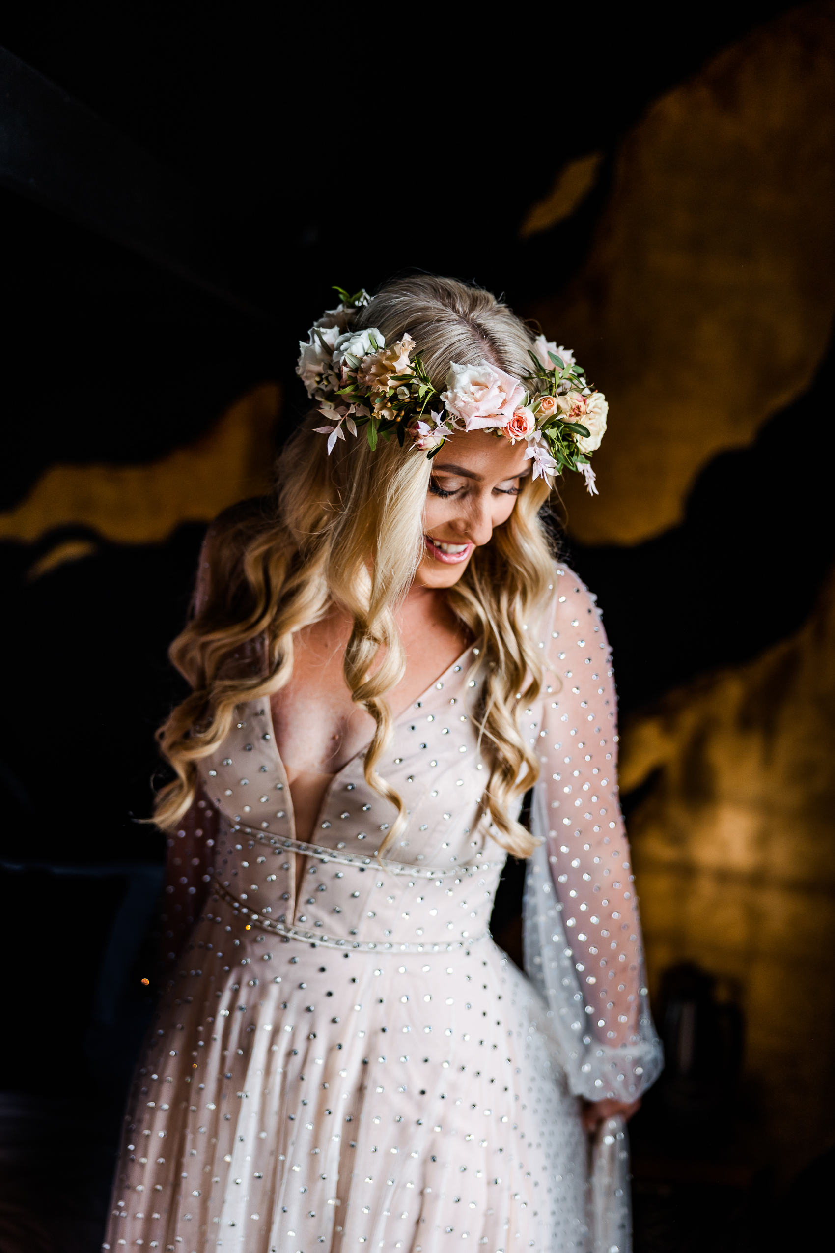 Bride in flower crown getting dressed