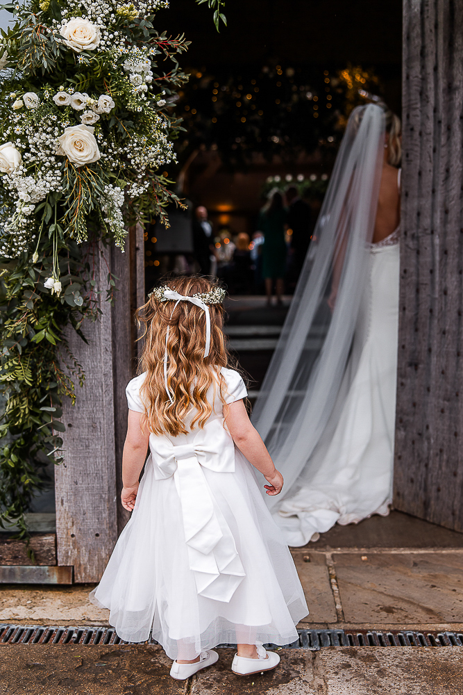 bridesmaid at the back door of Cripps barn