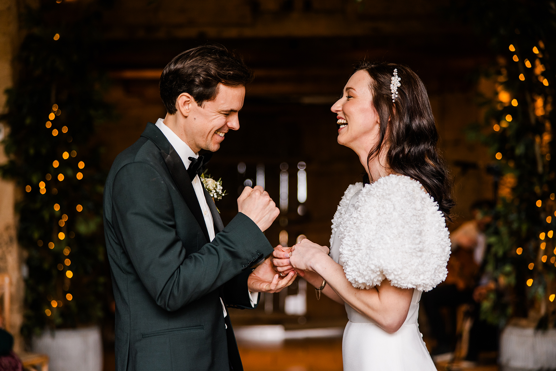 Couple saying their vows at stone Barn 