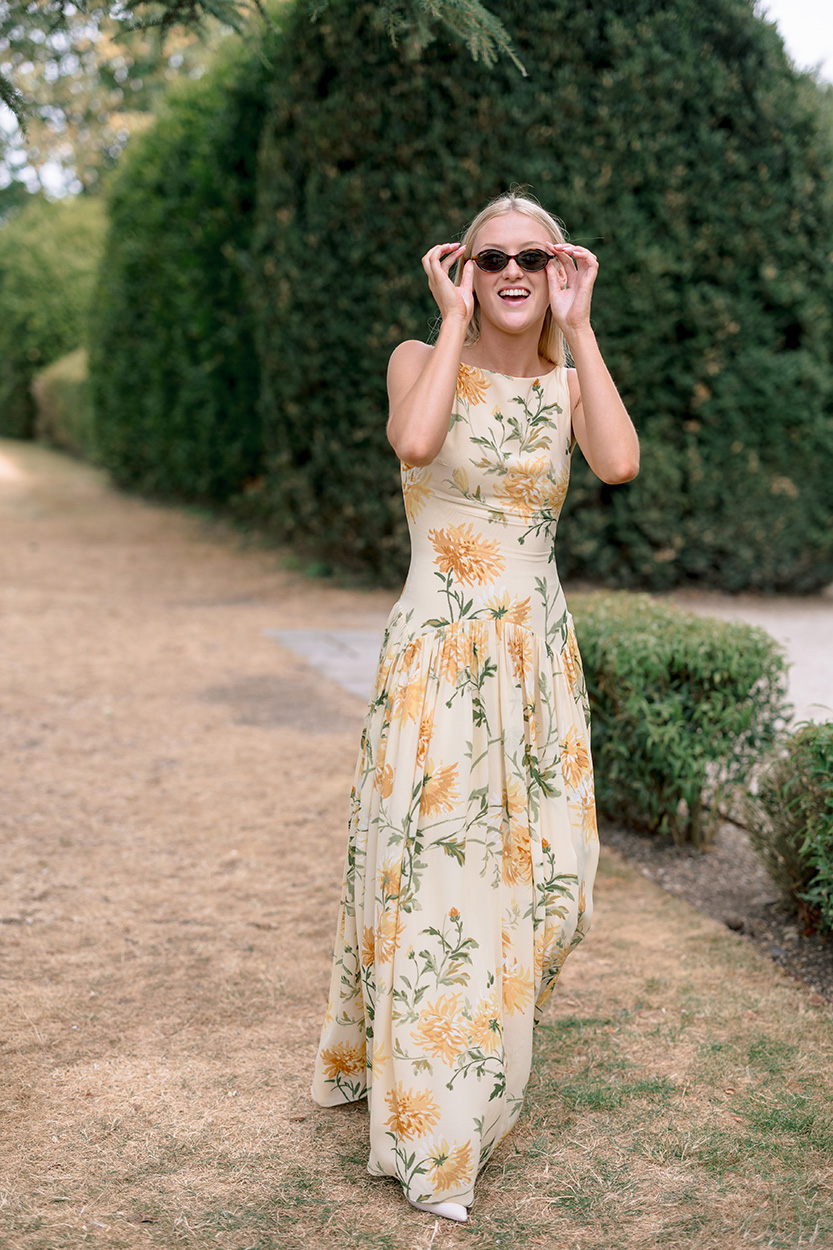 Guest laughing in a yellow dress