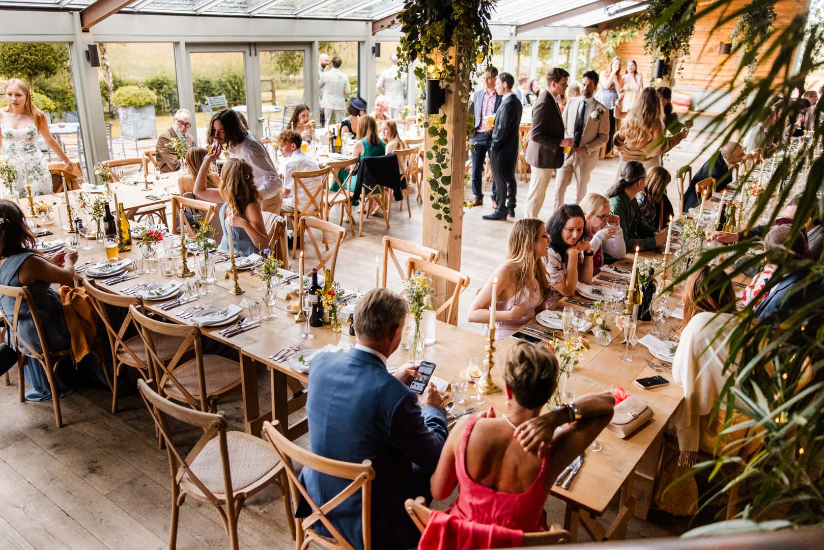 Couples up on the shoulders of their friends on the dancefloor