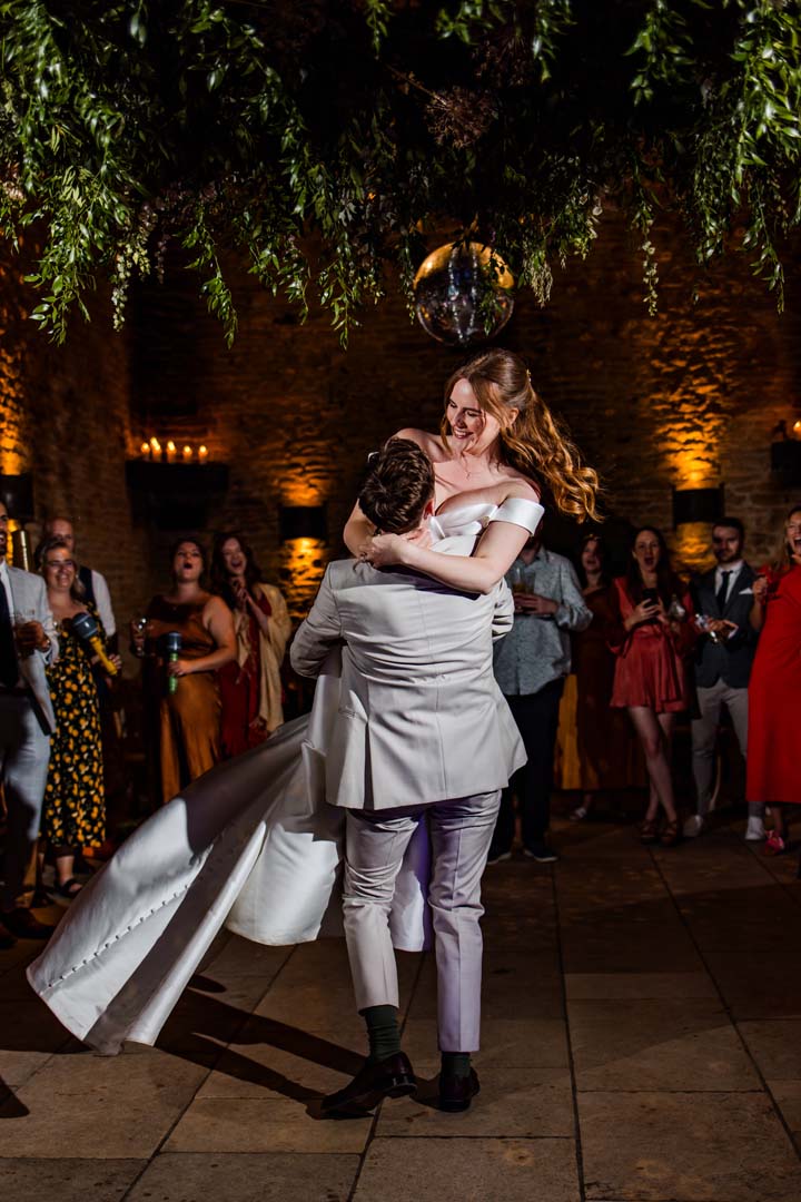 Bride and groom under oak tree 